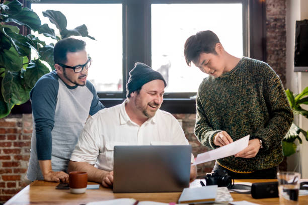 istock IT officer talking with his colleagues in the office 2157516441