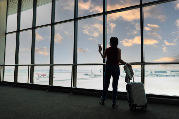istock Female passenger waiting her flight at airport 2157518199