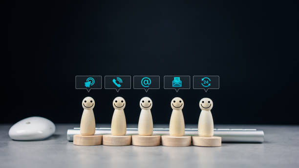 istock Customer service support hotline connection. Wood doll with speech bubble icon. 2157518225