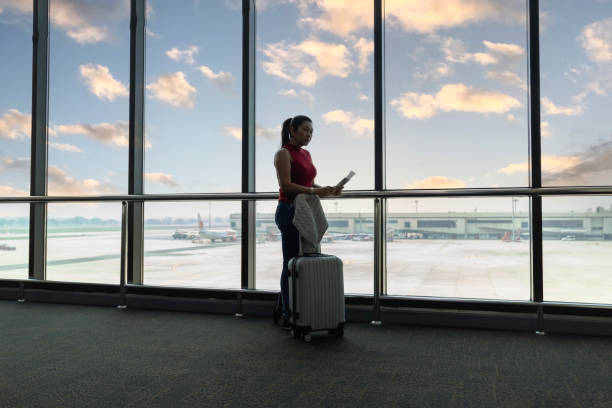 istock Female passenger waiting her flight at airport 2157518268