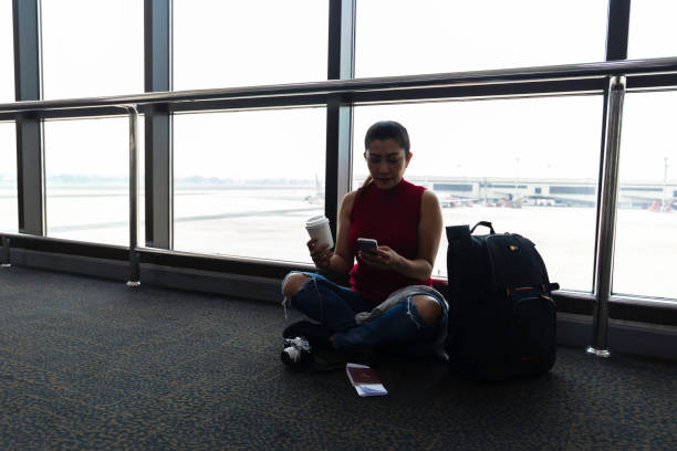 istock Female passenger waiting her flight at airport 2157518337