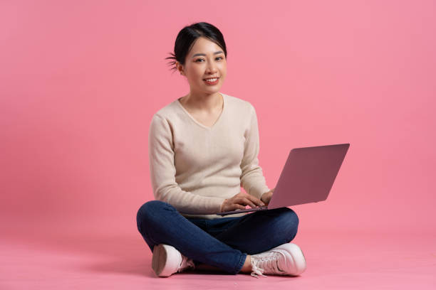 istock Image of beautiful Asian woman posing on a white background 2157520788
