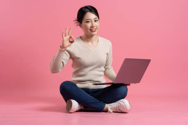 istock Image of beautiful Asian woman posing on a white background 2157520832