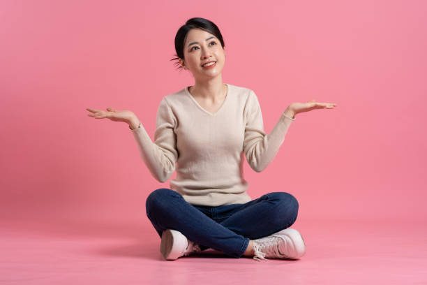 istock Image of beautiful Asian woman posing on a white background 2157520901