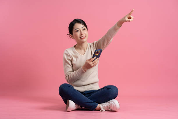 istock Image of beautiful Asian woman posing on a white background 2157521008