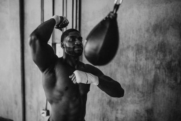 Muscular male boxer at the gym