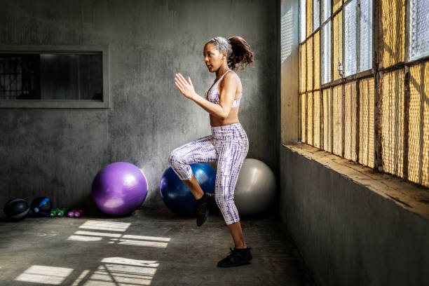 istock Sportive woman doing a high knees 2157521190