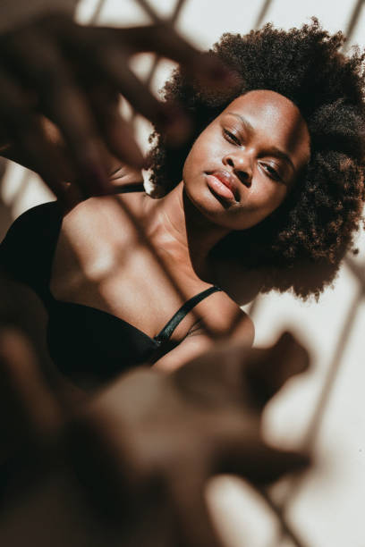 istock Shadows over a sensual black woman 2157524963