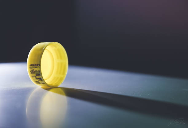 YELLOW CAP OF SODA BOTTLE