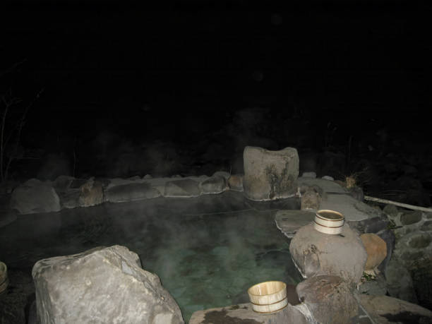 istock Japanese onsen hot spring batt tub in the night 2157526552
