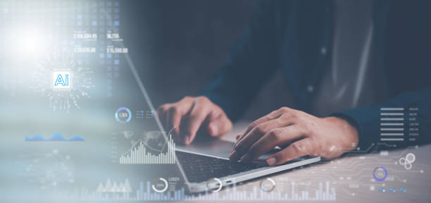 istock Hands typing on a laptop surrounded by AI-related data visuals, capturing the essence of cutting-edge artificial intelligence in business applications. 2157527146