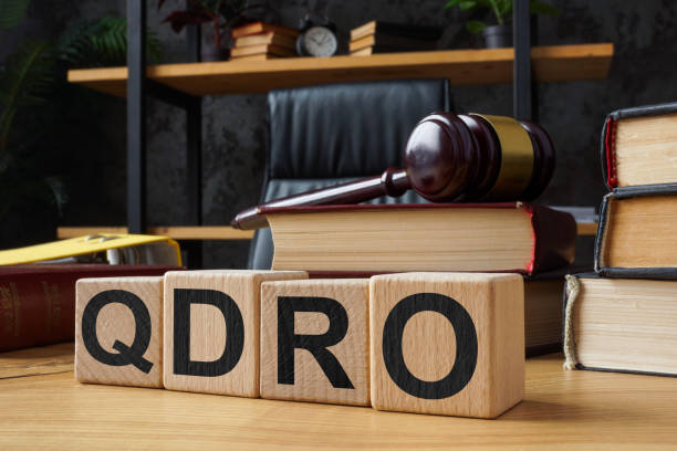 istock Table and cubes with abbreviation QDRO Qualified Domestic Relations Order. 2157527228