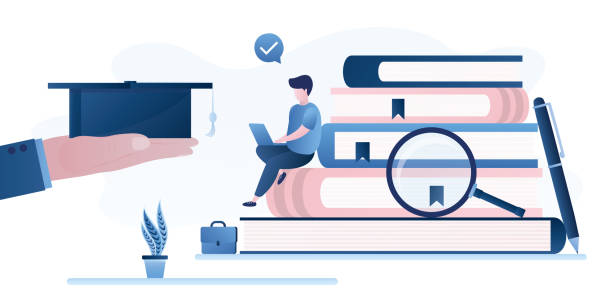 istock The end of course or college, male student receives graduate hat. Learning process, pile of books, young adult uses gadget. MBA degree, new profession training. Education concept. 2157527343