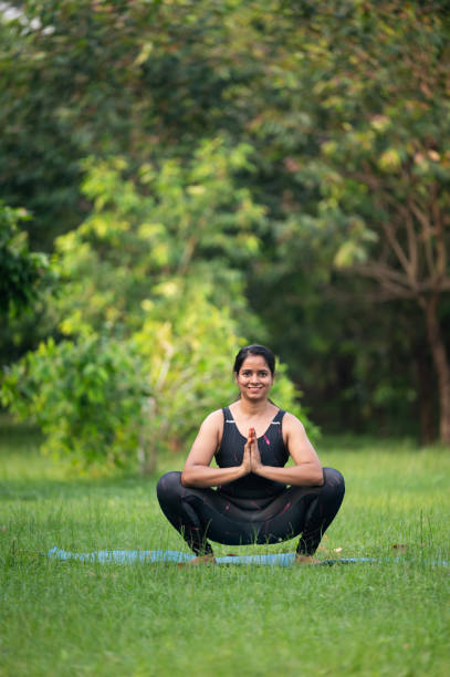 istock Woman's yoga practice on an exercise mat 2157528320