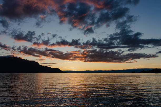 istock Dusk sky over tranquil waters and mountains 2157529654