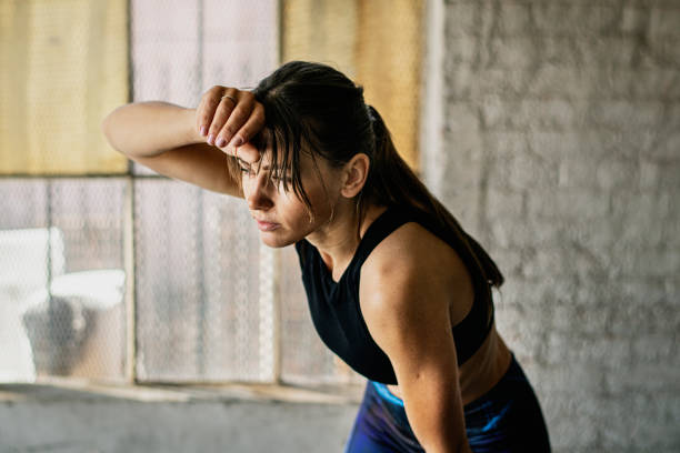 istock Tired sporty woman after work out 2157529964