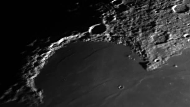 Photo of the moon's surface through a telescope.