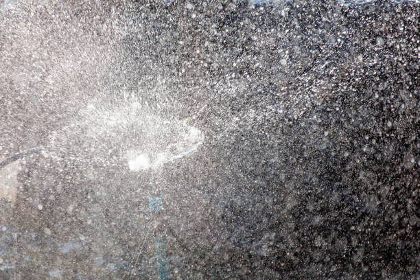 istock Splashes of water when watering as an abstract background. Texture 2157531352