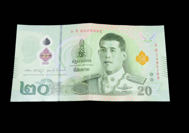 Twenty Thai Baht isolated on black background.
