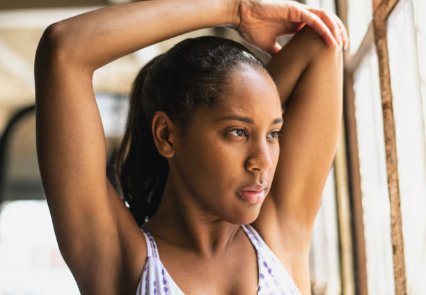 istock Woman stretching in a gym 2157533217