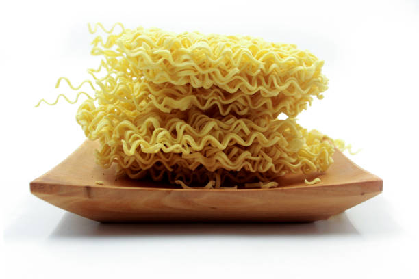 dry noodles, egg noodles, isolated on a white background