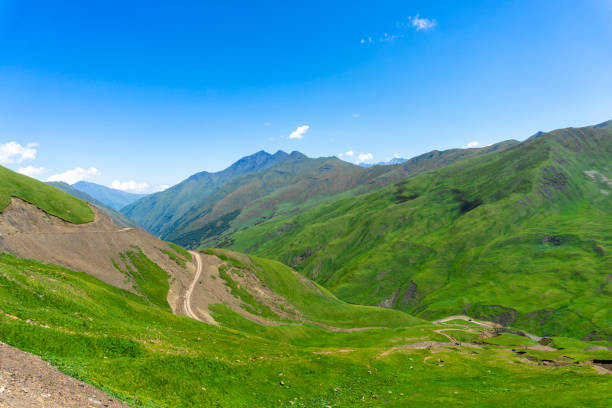 istock Mountain road leading to the Datvisjvari pass. Mountains covered with green vegetation 2157537928