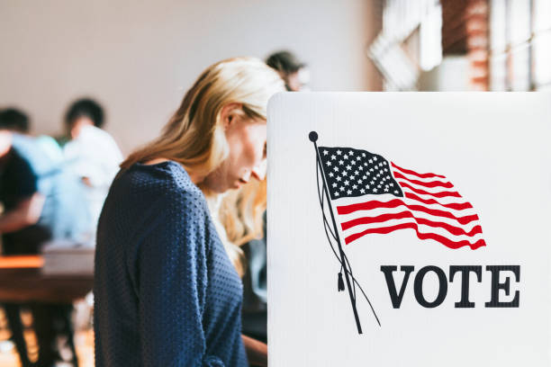 istock American at a polling booth 2157540058
