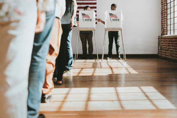 istock American at a polling booth 2157540138