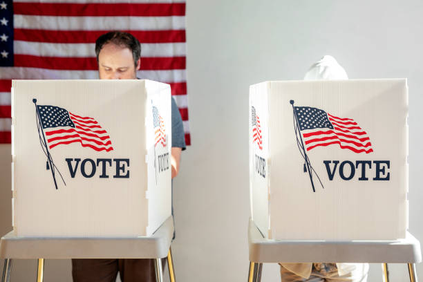 istock American at a polling booth 2157540142