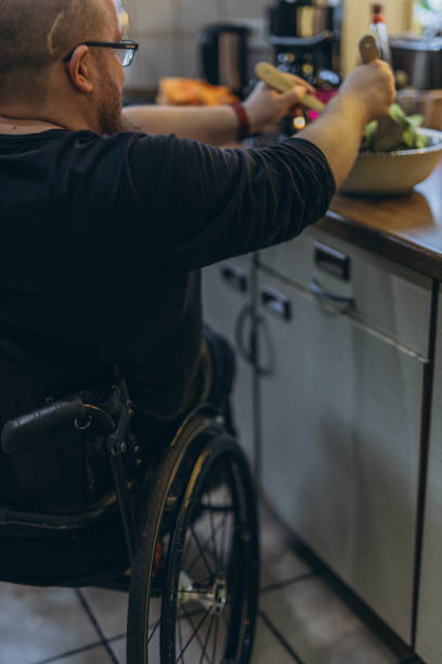 istock A young man sitting in a chair looking out the window 2157541128