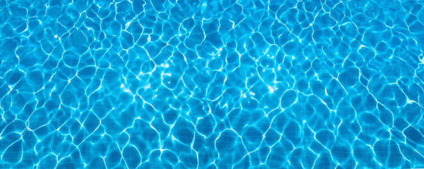 istock Abstract shiny water surface of swimming pool. 2157541317