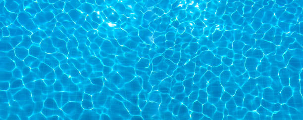 Abstract shiny water surface of swimming pool.