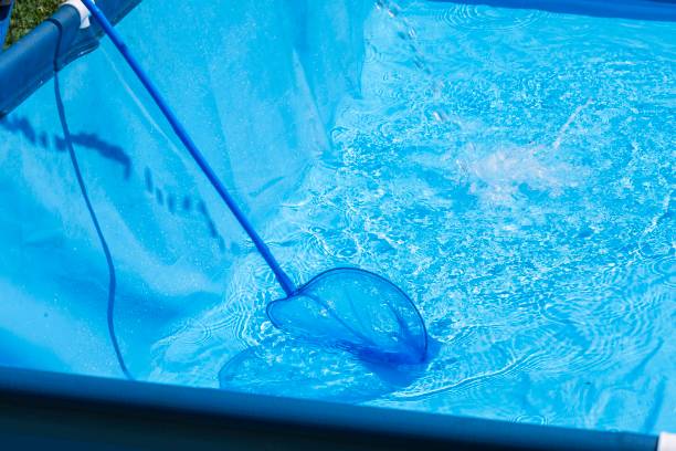 istock process of achieving clear, debris-free water in a swimming pool through regular maintenance 2157541419