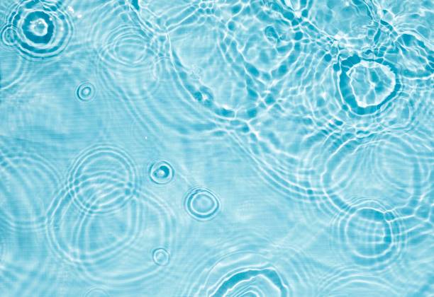 istock Abstract water, cosmetic background with rings, water surface. Spa concept background. Splash cosmetic moisturizer water micellar toner or emulsion 2157541711