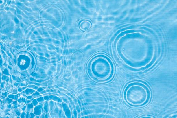 istock Abstract water, cosmetic background with rings, water surface. Spa concept background. Splash cosmetic moisturizer water micellar toner or emulsion 2157541758