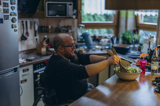istock young man in a chair making a salad 2157541843