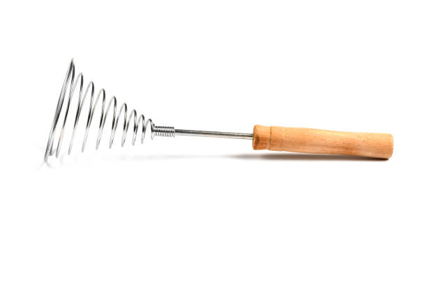 istock Close-up of old retro whisk kitchen tool on white background. Side view. 2157541891