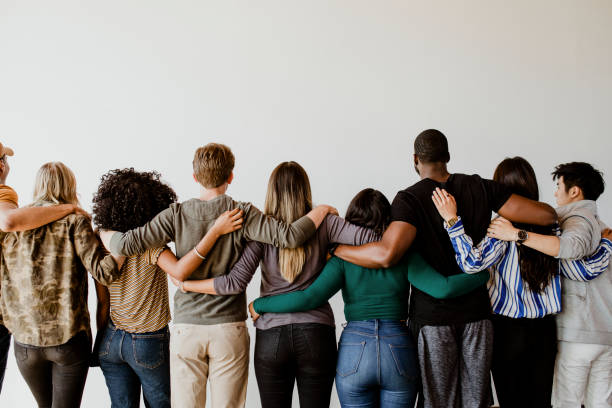 istock Rearview of diverse people hugging each other 2157542789