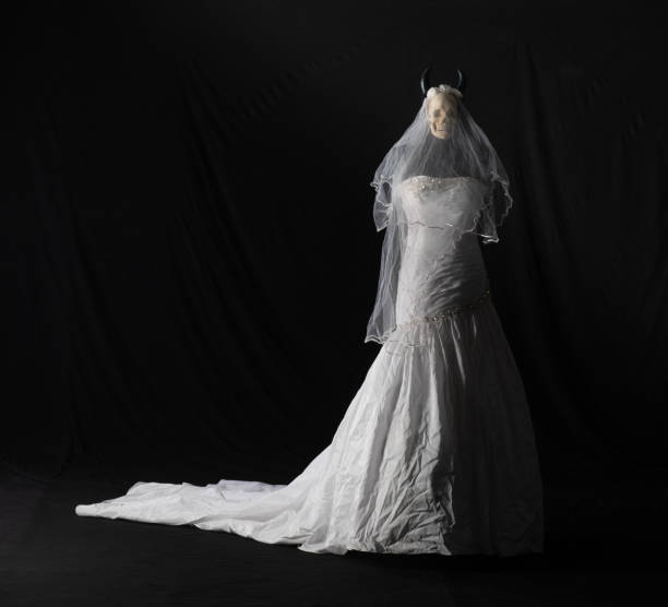 istock halloween white wedding dress with a skull on a black background 2157542926
