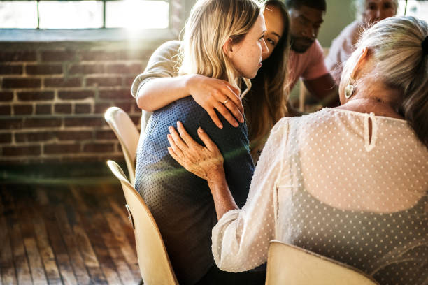 istock People support each other in a rehab session 2157543737