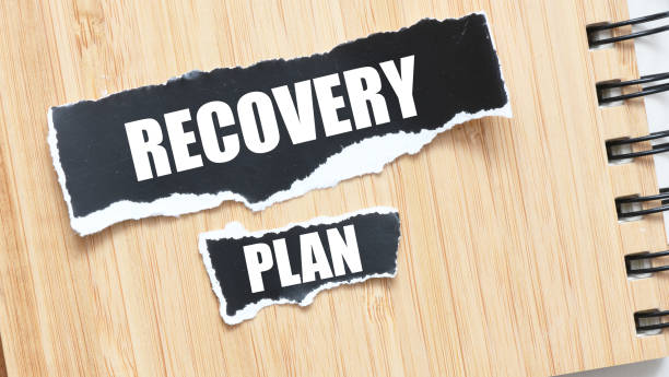 istock RECOVERY PLAN words on black sheets of paper. 2157545185
