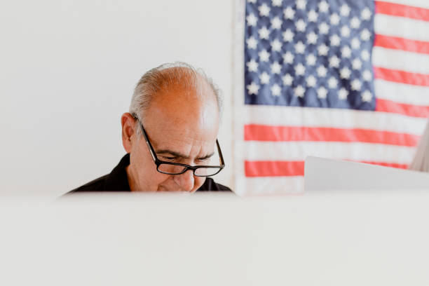 istock Elderly American man at a polling booth 2157545828