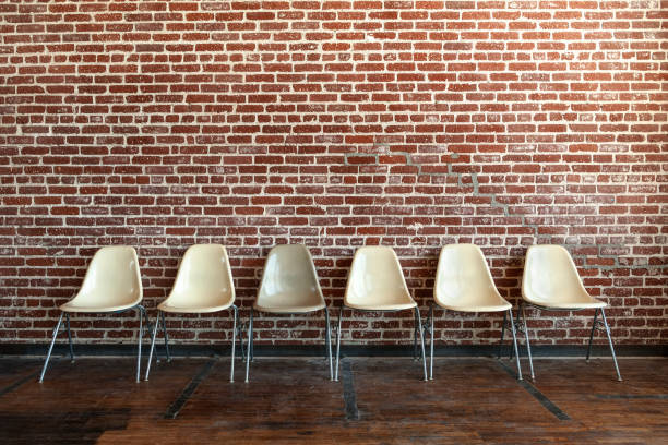 istock Available seats in front of the wall 2157546182