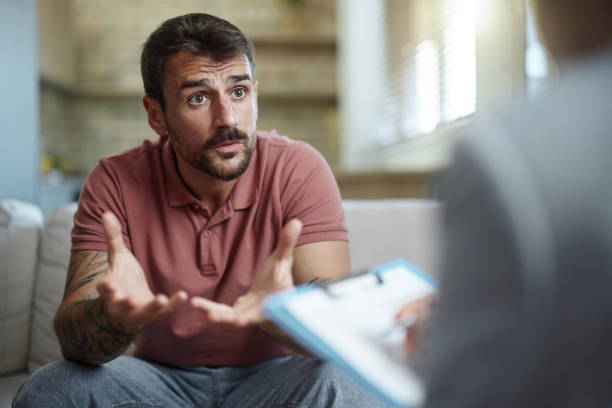 istock Young man talking to his advisor at home. 2157546498