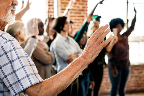 istock People raising their hands in a seminar 2157546533
