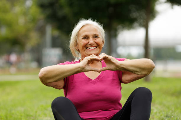 istock Active senior woman making a heart with her hands 2157548991