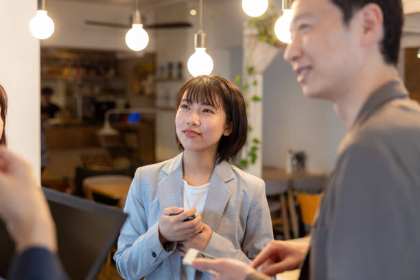 istock Freelance workers having scrum meeting in cafe / co-working space 2157550338