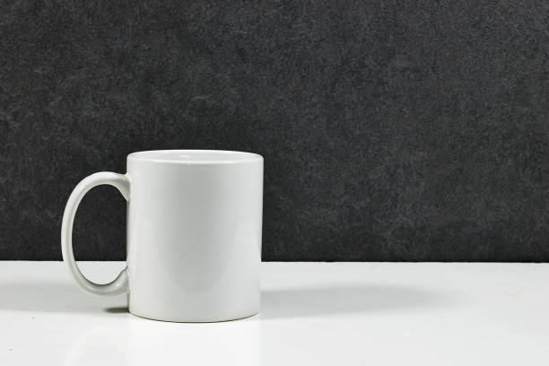 istock white coffee mug , white porcelain mug mock up on white wood table 2157551604