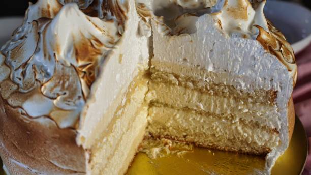 istock Lemon Meringue Cake With a Slice Removed 2157552199