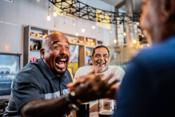 istock Happy senior friends talking on the bar 2157552452